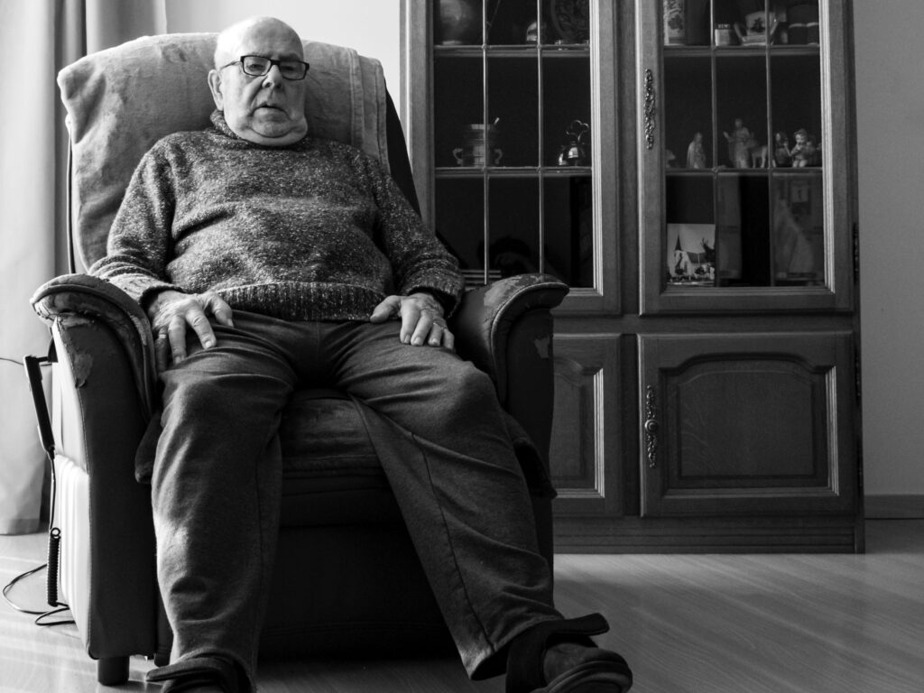 Lonely man in armchair